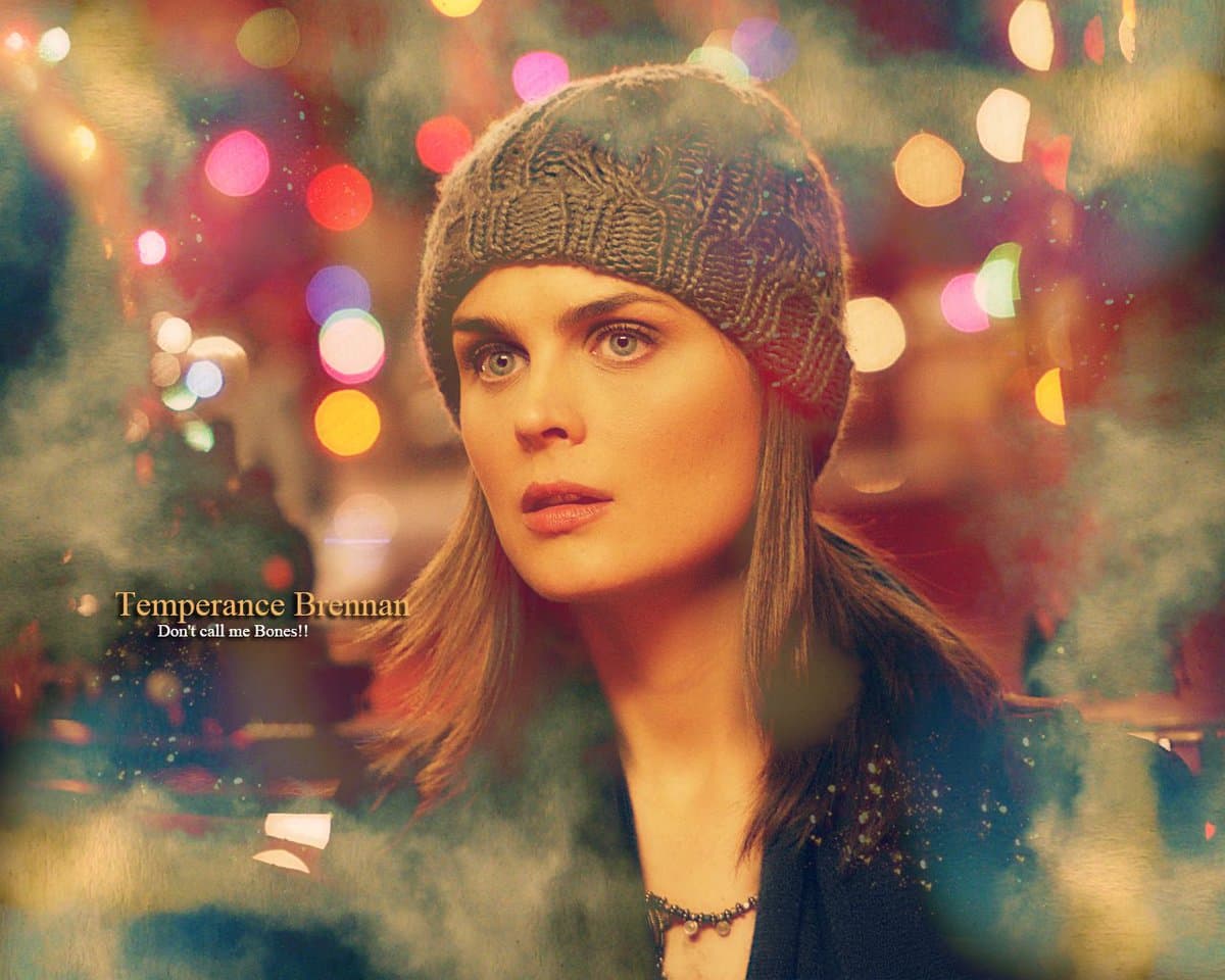 A promotional still of a woman wearing a knit beanie against a background of blurred, colorful holiday lights. The image includes text overlays identifying the character as Temperance Brennan.
