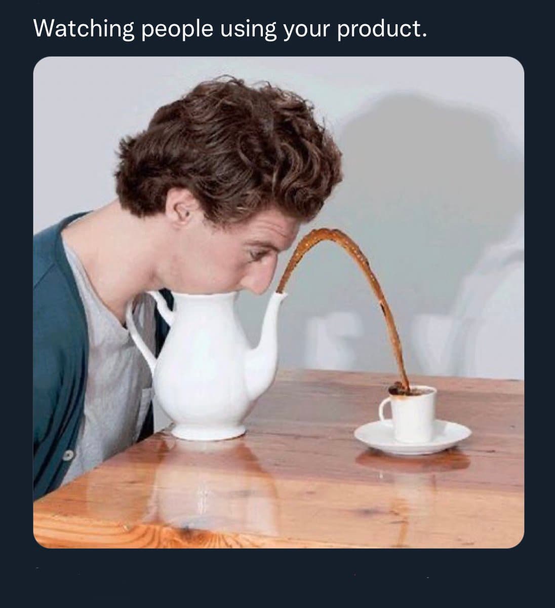 A humorous image showing a person with their head inside a white coffee pot, with a stream of coffee pouring from the spout into a cup on a wooden table. The image is captioned with text at the top.