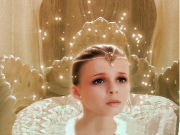 A young girl with a serious expression sits on an ornate, golden throne, wearing a jeweled headband and a white ruffled dress. The background is a soft, golden color with sparkling light effects, creating a regal and ethereal atmosphere.