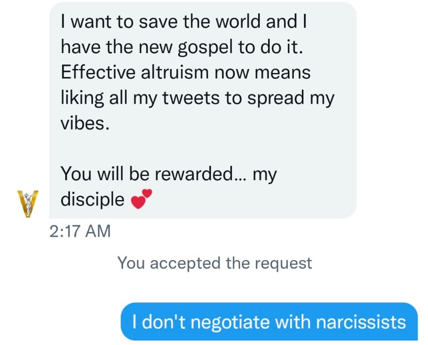 A screenshot of a text message conversation showing a message from a verified account and a reply. The first message is in a light gray bubble, and the reply is in a blue bubble. The conversation includes a timestamp and a status line.