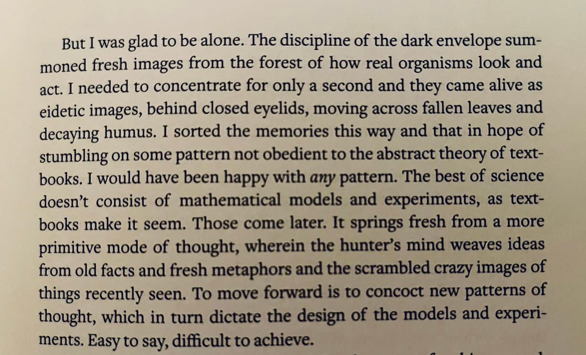 A close-up photograph of a printed page from a book, showing a paragraph of text on a cream-colored background.