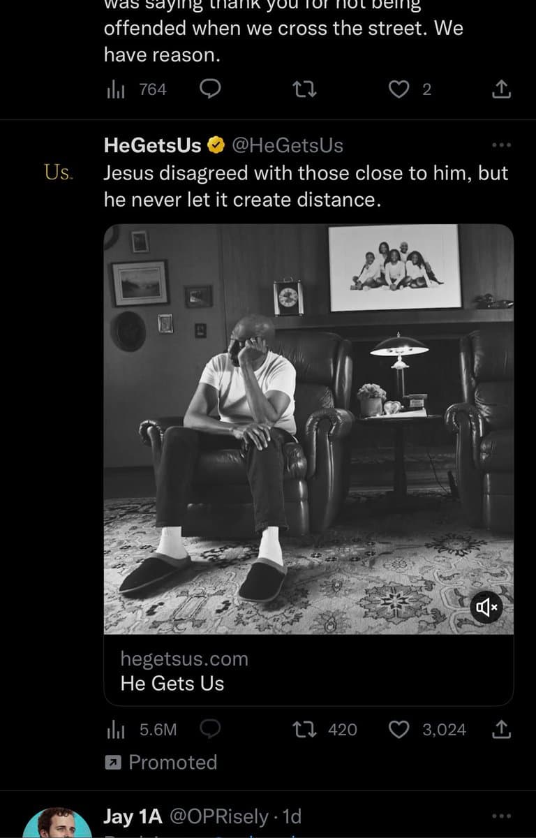 A screenshot of a Twitter feed showing a promoted advertisement from the account @HeGetsUs. The ad features a black-and-white video of a man sitting in a leather armchair, accompanied by the text: 'Jesus disagreed with those close to him, but he never let it create distance.'