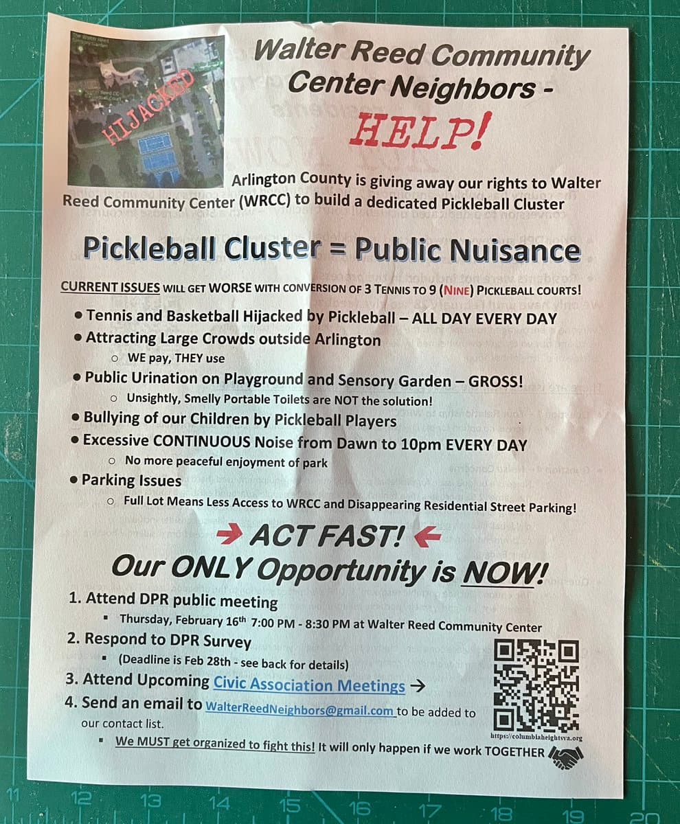 A photograph of a printed flyer titled 'Walter Reed Community Center Neighbors - HELP!' laid on a green cutting mat. The flyer argues against the conversion of tennis courts to a pickleball cluster, listing issues such as noise, bullying, and parking, and urges residents to attend a public meeting and contact the organizers.