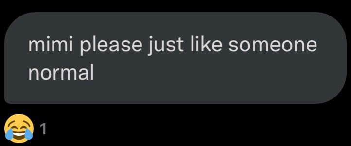 A screenshot of a text message bubble on a dark background. Below the message, there is a laughing-crying emoji with a reaction count of 1.