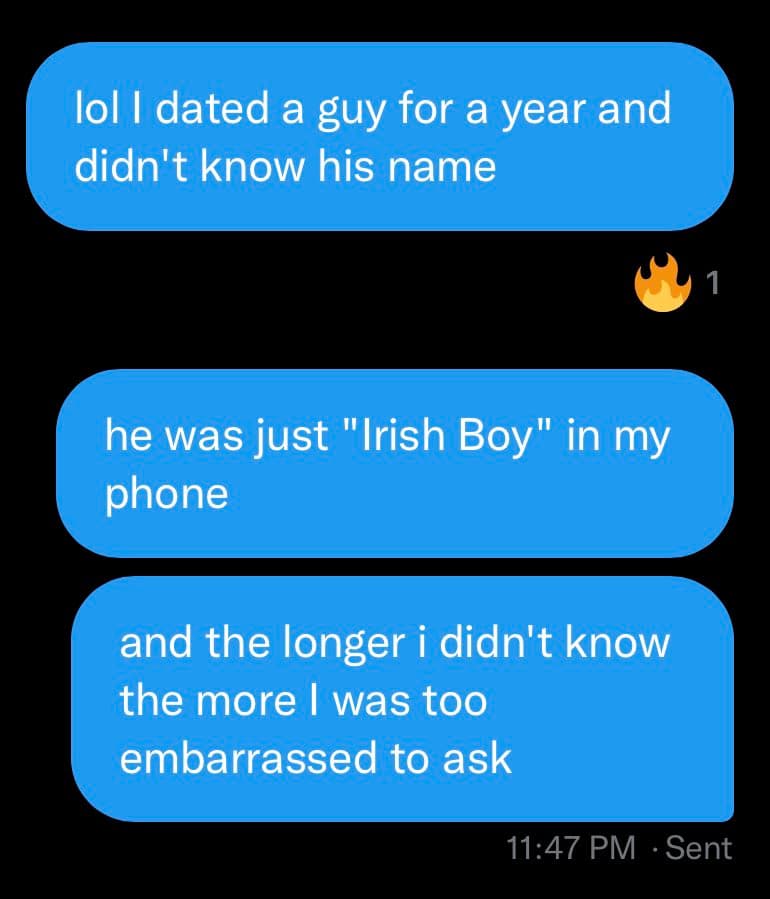 A screenshot of a text message conversation showing three blue message bubbles on a black background. The messages tell a humorous story about dating someone for a year without knowing their name. A fire emoji with the number 1 appears as a reaction to the first message, and a timestamp of 11:47 PM is visible at the bottom.