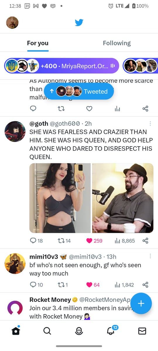 A screenshot of a Twitter mobile feed showing a tweet from user @goth600. The tweet includes a side-by-side image of a woman taking a mirror selfie and a man speaking into a microphone, accompanied by the text: 'SHE WAS FEARLESS AND CRAZIER THAN HIM. SHE WAS HIS QUEEN, AND GOD HELP ANYONE WHO DARED TO DISRESPECT HIS QUEEN.' Below it is a reply from user @mimi10v3.