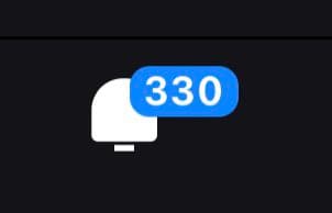 A screenshot of a notification icon on a dark background, showing a white speech bubble with a blue badge displaying the number 330. The image is likely a cropped view of a phone's notification center or app icon.