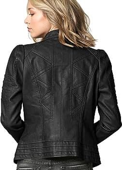 A woman with blonde hair is shown from the back, wearing a black leather jacket with a high collar and decorative stitching on the back panel.