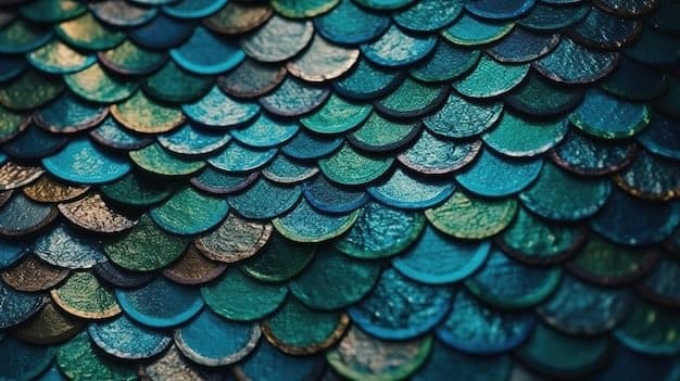 A close-up photograph of overlapping, iridescent scales in shades of blue, green, and gold, resembling the skin of a fish or dragon. The scales have a textured, slightly wet appearance with varying levels of focus across the frame.