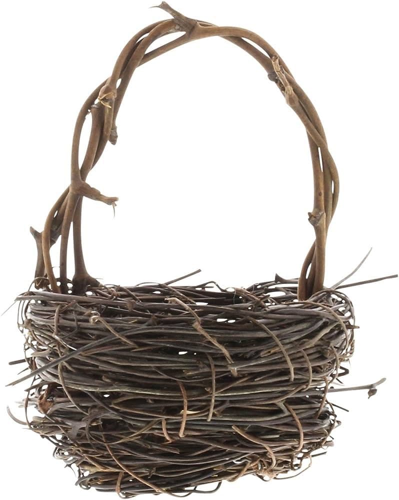 A handcrafted basket woven from thin, brown twigs and branches, featuring a tall, arched handle made from thicker, twisted vines.