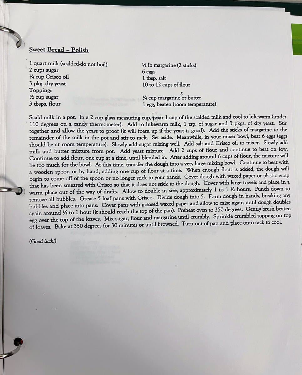 A photograph of a page from a spiral-bound recipe book, showing a typed recipe for 'Sweet Bread - Polish'. The page lists ingredients and detailed preparation instructions.