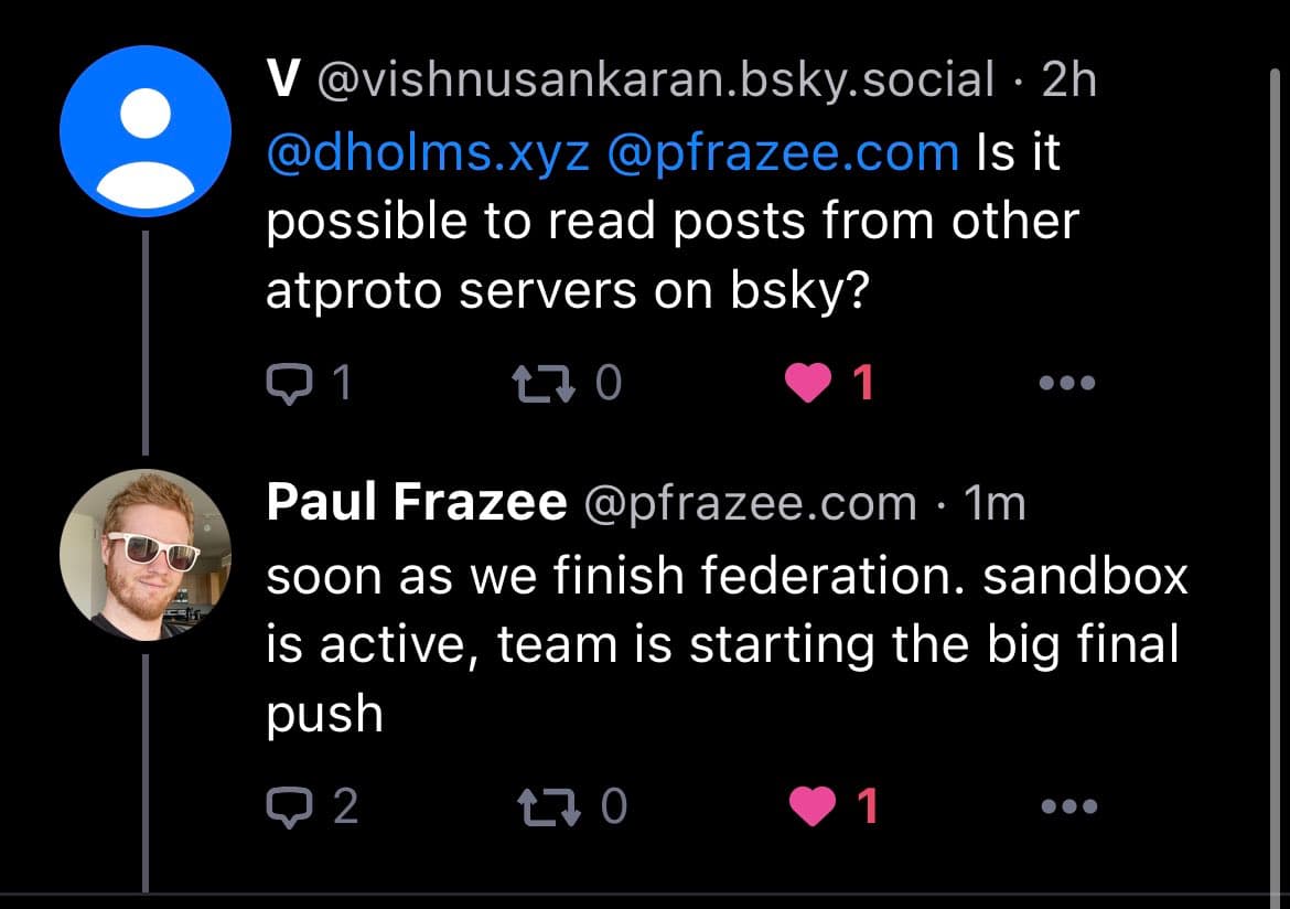 A screenshot of a social media conversation on a dark-themed interface, showing a question about reading posts from other servers and a reply about federation progress.