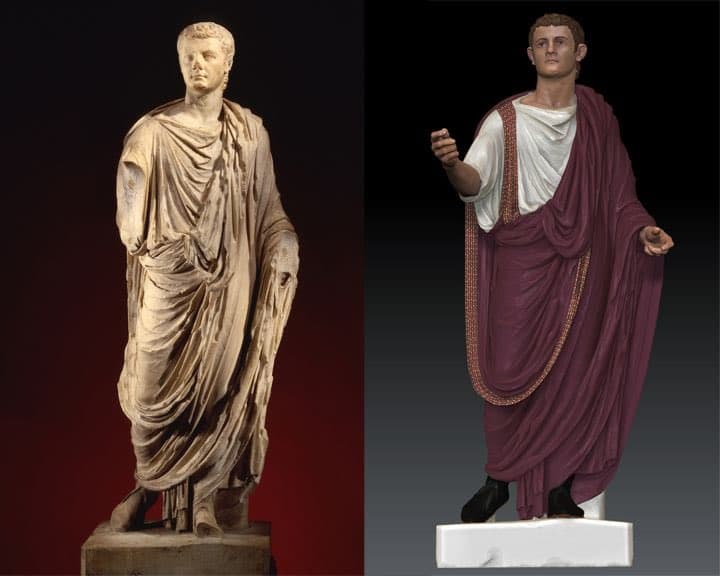 A side-by-side comparison of a classical marble statue on the left and a digitally restored, colored version of the same statue on the right. The restored version features a white tunic, a purple toga with gold trim, and brown hair.