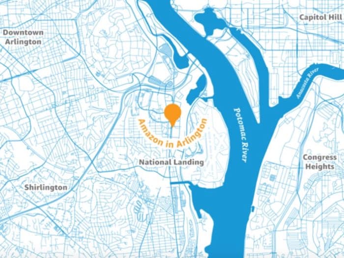 A stylized map of the Arlington, Virginia area showing the location of the Amazon in Arlington facility, marked with an orange pin, near the Potomac River and National Landing.