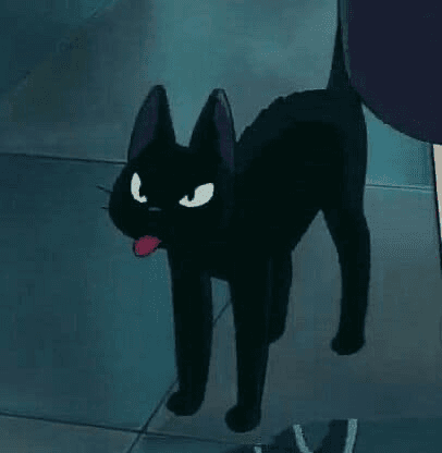 A screenshot of an animated black cat with wide white eyes and a small pink tongue sticking out, standing on a tiled floor.