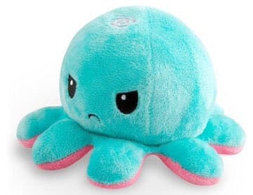 A teal plush octopus toy with a round head, large black eyes, and a small frowning mouth. It has eight tentacles with pink undersides, and a small circular logo is visible on the top of its head.