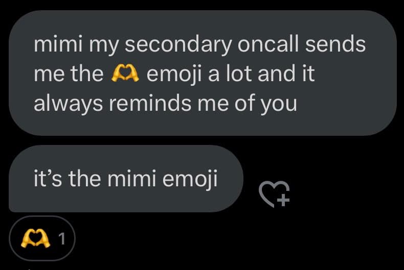 A screenshot of a text message conversation on a dark-themed messaging app. The conversation consists of two messages discussing the meaning of the 'mimi' emoji (two hands forming a heart).