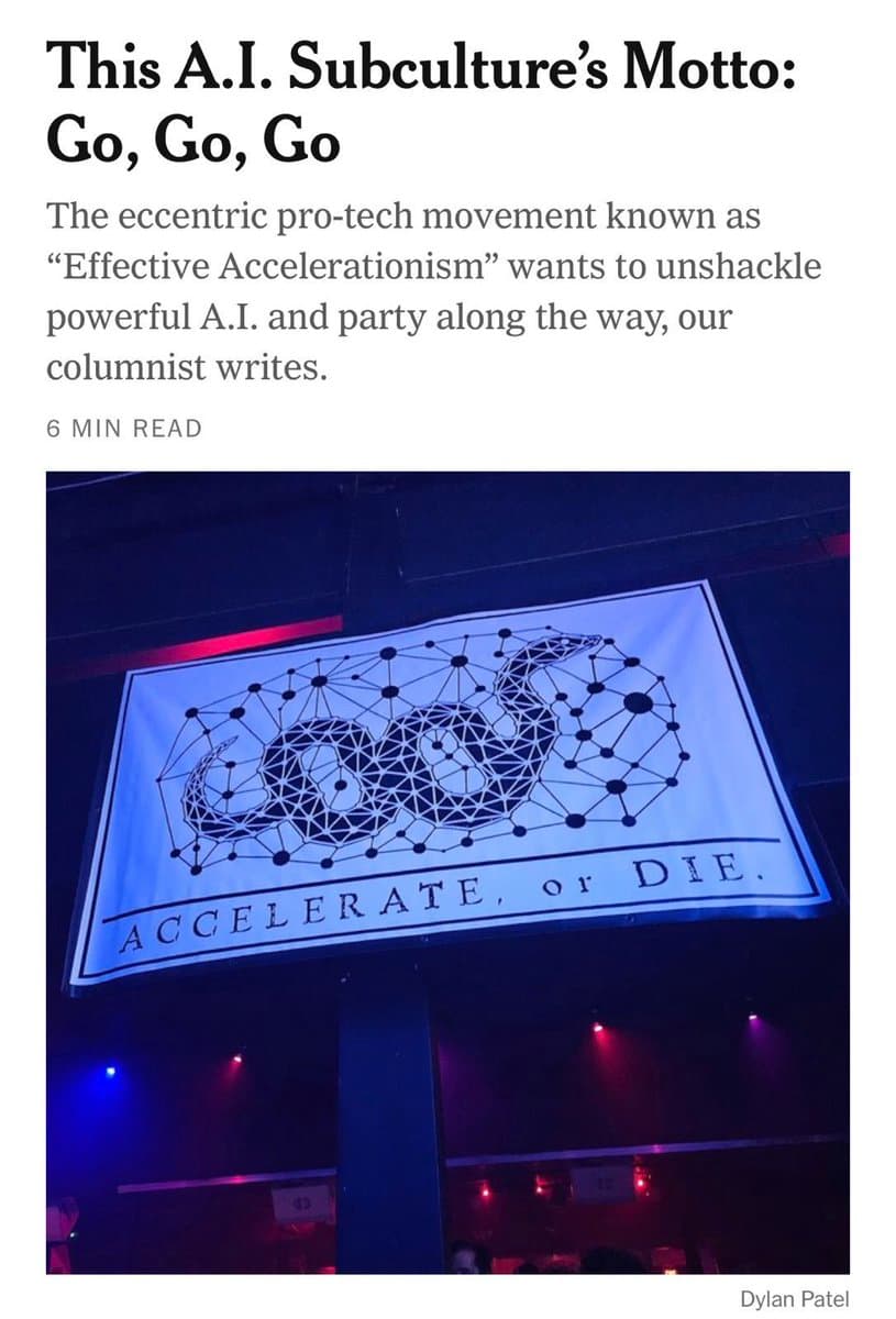 A screenshot of a news article featuring a headline and a photo of a banner. The banner displays a geometric, network-style illustration of a creature and the text 'ACCELERATE, or DIE.'