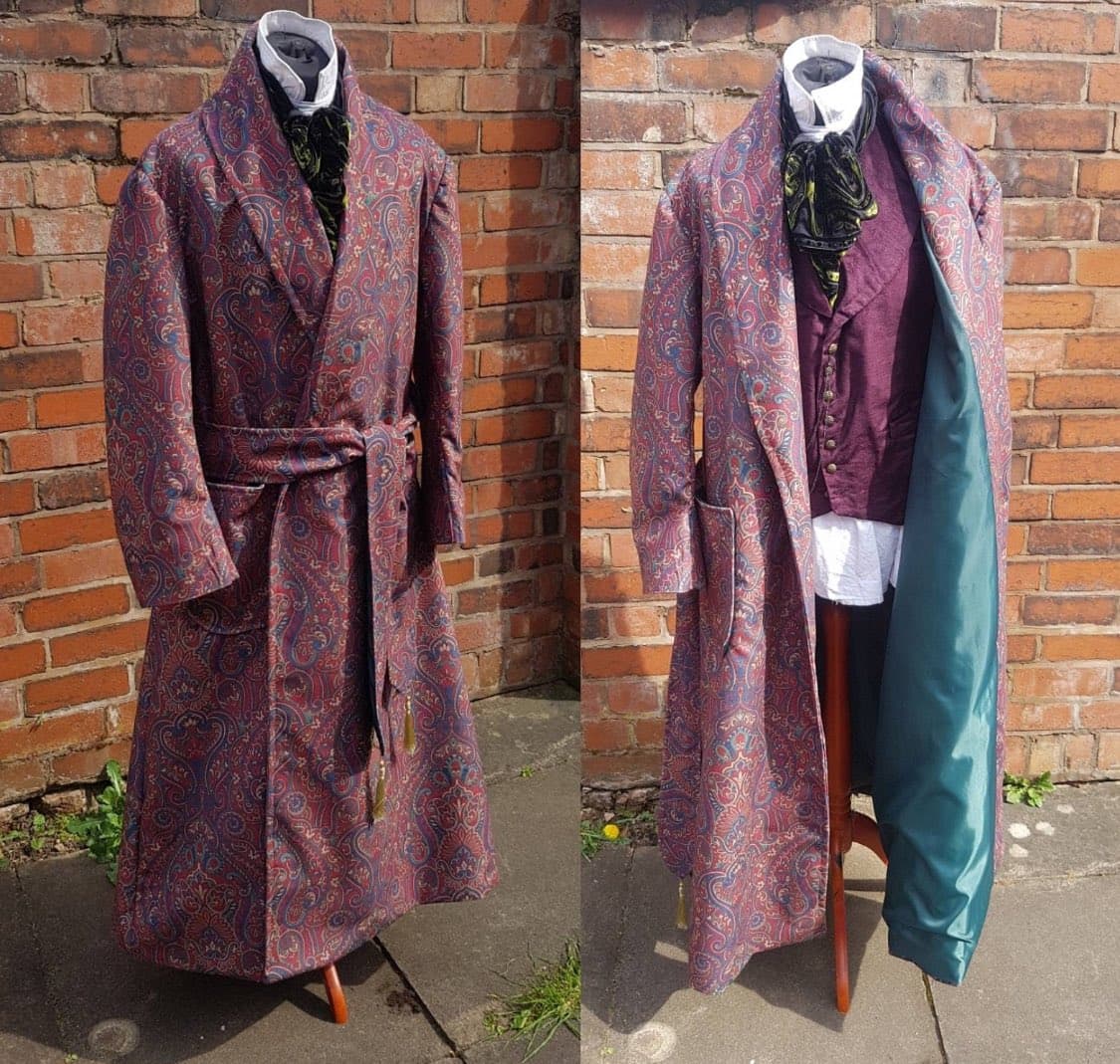 A side-by-side photograph showing a long, patterned coat displayed on a mannequin against a brick wall. The left image shows the coat closed, while the right image shows it open to reveal a teal lining and a maroon waistcoat underneath.