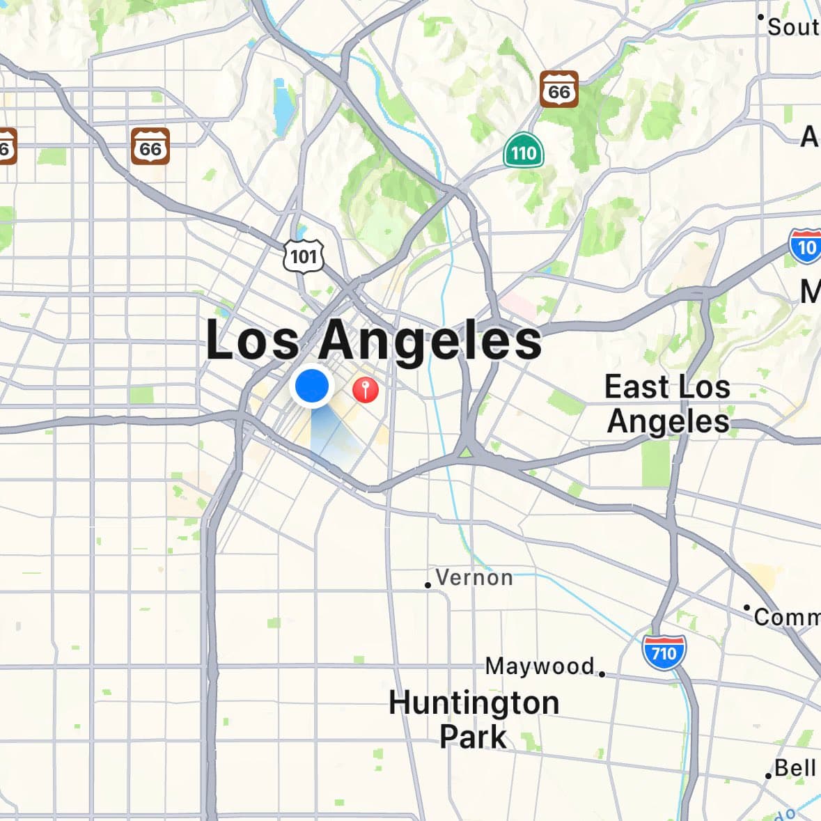 A digital map showing a section of Los Angeles and its surrounding areas, including East Los Angeles, Huntington Park, Maywood, and Vernon. The map displays a grid of streets, major highways with route shields (66, 101, 110, 710, and 10), and two location markers (one blue and one red) near the center of Los Angeles.