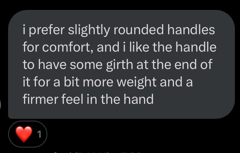 A screenshot of a dark-mode text message bubble containing a detailed description of a preferred handle design. Below the bubble is a red heart reaction icon with the number 1.