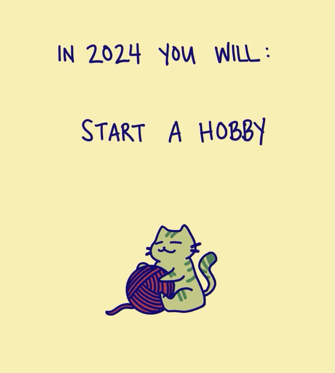 A digital illustration on a pale yellow background featuring a cartoon green cat hugging a ball of purple yarn. Handwritten-style text above the cat reads 'IN 2024 YOU WILL: START A HOBBY'.