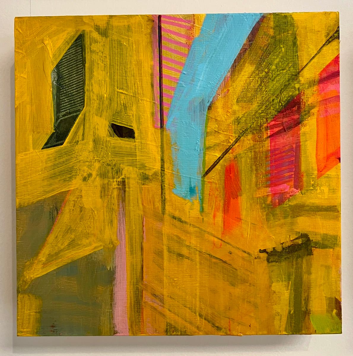 A square abstract painting featuring bold, textured brushstrokes in vibrant yellow, with accents of blue, pink, red, and green. The composition includes geometric shapes and diagonal lines, creating a dynamic and energetic visual effect.