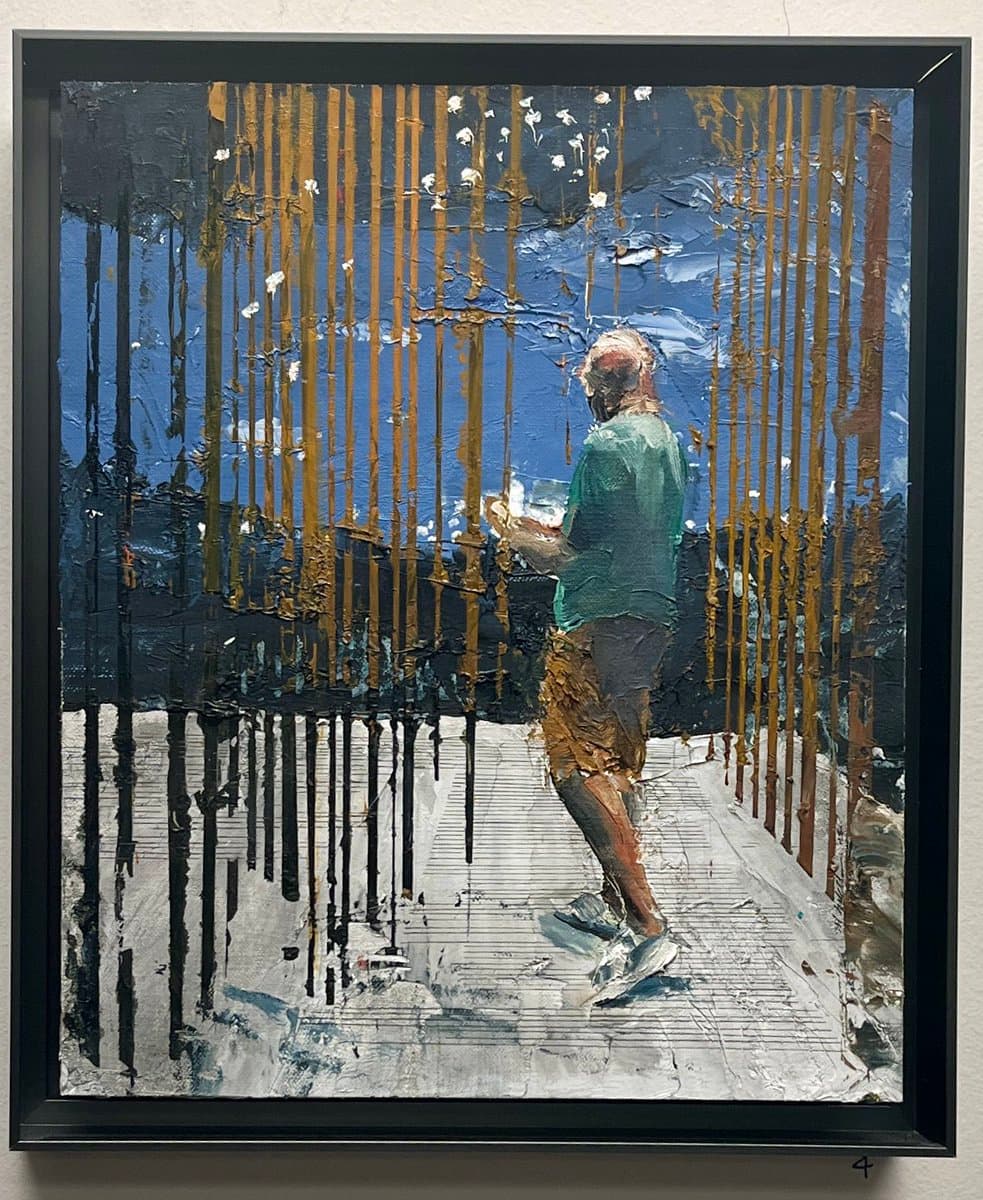 A framed oil painting depicting a person standing on a white surface, viewed from behind, with vertical streaks of gold and black paint dripping down the canvas. The background features a blue sky with white clouds, and the figure is wearing a green shirt and patterned shorts.