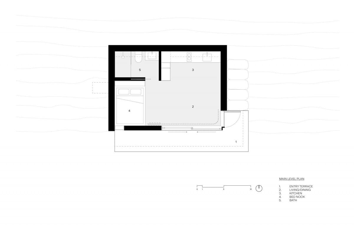 Architectural floor plan of a small cabin showing the main level layout. The plan includes a legend identifying five areas: an entry terrace, living/dining space, kitchen, bed nook, and bath.