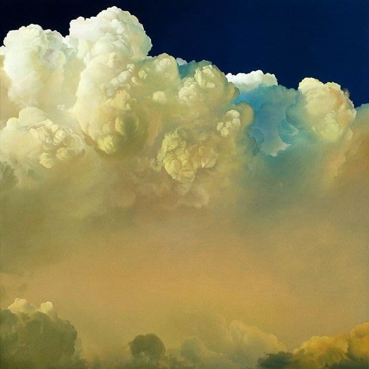 An oil painting depicting a dramatic sky filled with large, billowing cumulus clouds. The clouds are rendered in soft, creamy whites and yellows against a deep blue background, with a hazy, golden atmosphere below.