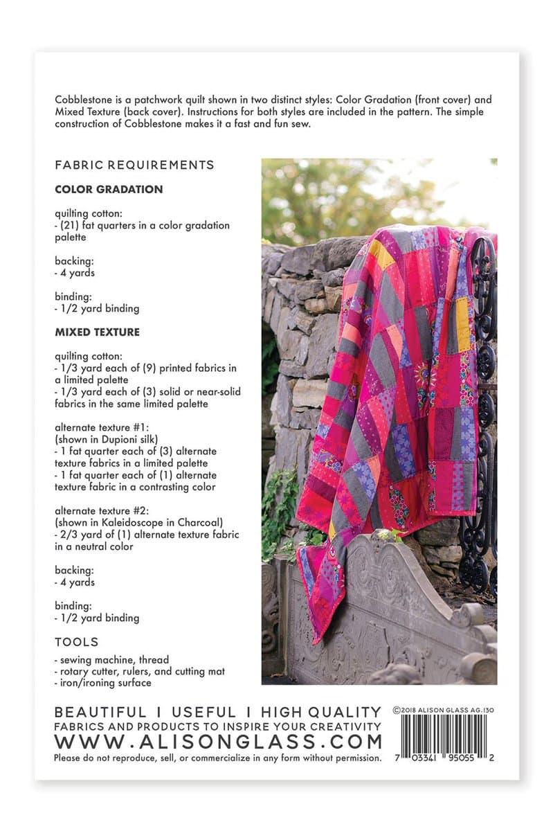 A product information sheet for a quilt pattern, featuring a photo of a colorful patchwork quilt draped over a stone wall and a detailed list of fabric and tool requirements. The text describes the 'Cobblestone' quilt in two styles: Color Gradation and Mixed Texture.