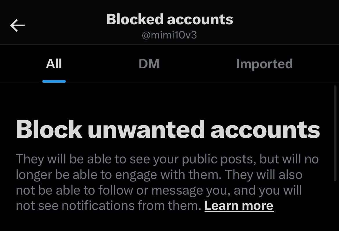 A screenshot of a mobile app's 'Blocked accounts' settings page, showing an empty list with a prompt to block unwanted accounts. The interface is in dark mode with tabs for 'All', 'DM', and 'Imported' accounts.