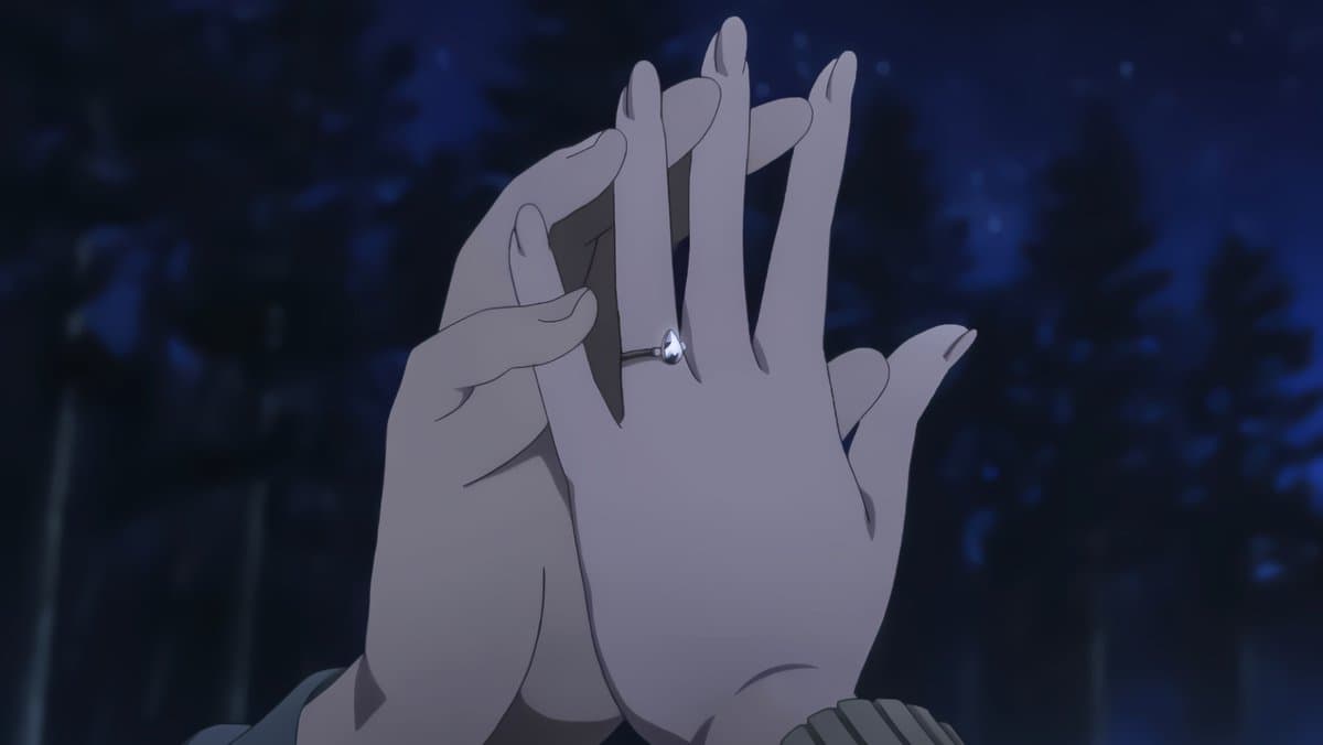 An anime-style illustration showing a close-up of two hands clasped together against a dark, blurry background. One hand is gently holding the other, which features a ring with a teardrop-shaped gem on the ring finger.