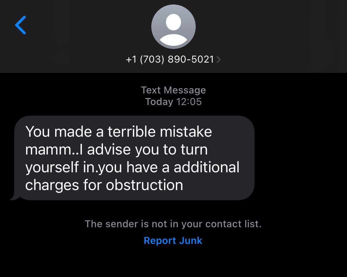 A screenshot of a text message conversation on a mobile phone, showing a message from an unknown number. The message is a threatening follow-up to a scam call about jury duty.