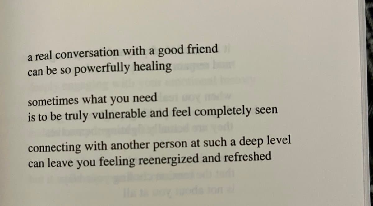 A close-up photograph of a page from a book featuring printed text about the healing power of deep conversations with friends.