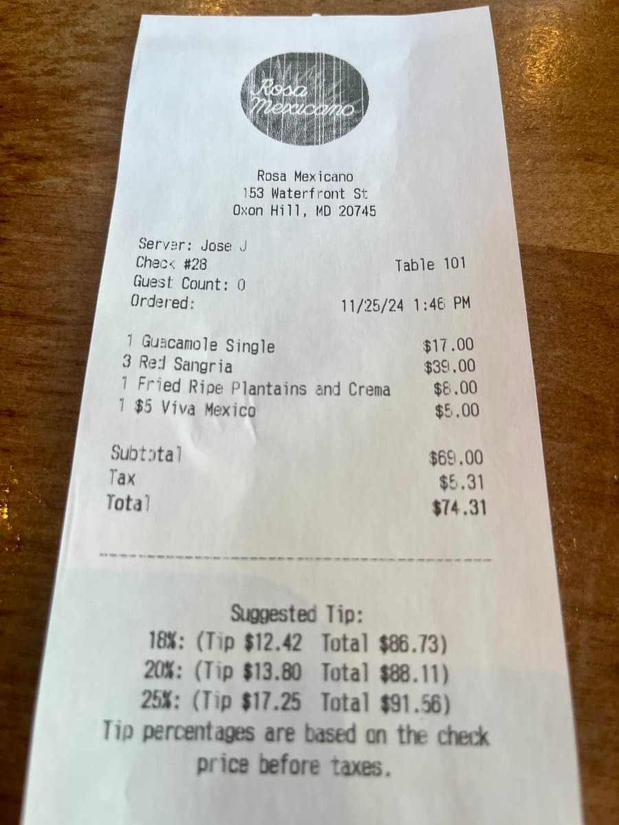 A photograph of a printed restaurant receipt from Rosa Mexicano in Oxon Hill, Maryland, showing a bill for four items totaling $74.31. The receipt lists the server, table number, order date, and suggested tip percentages.