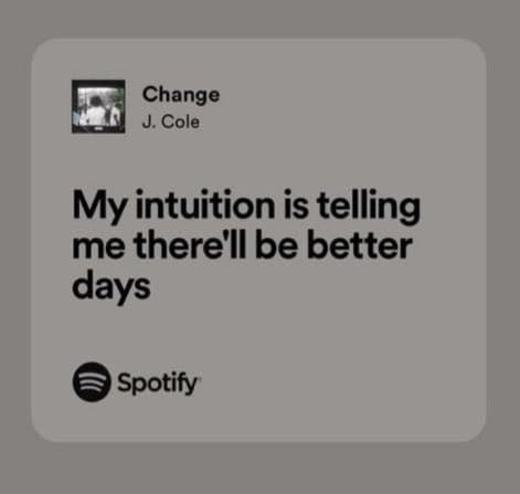 A Spotify share card displaying a song preview. The card shows the song title, artist name, and a lyric snippet on a light gray background.