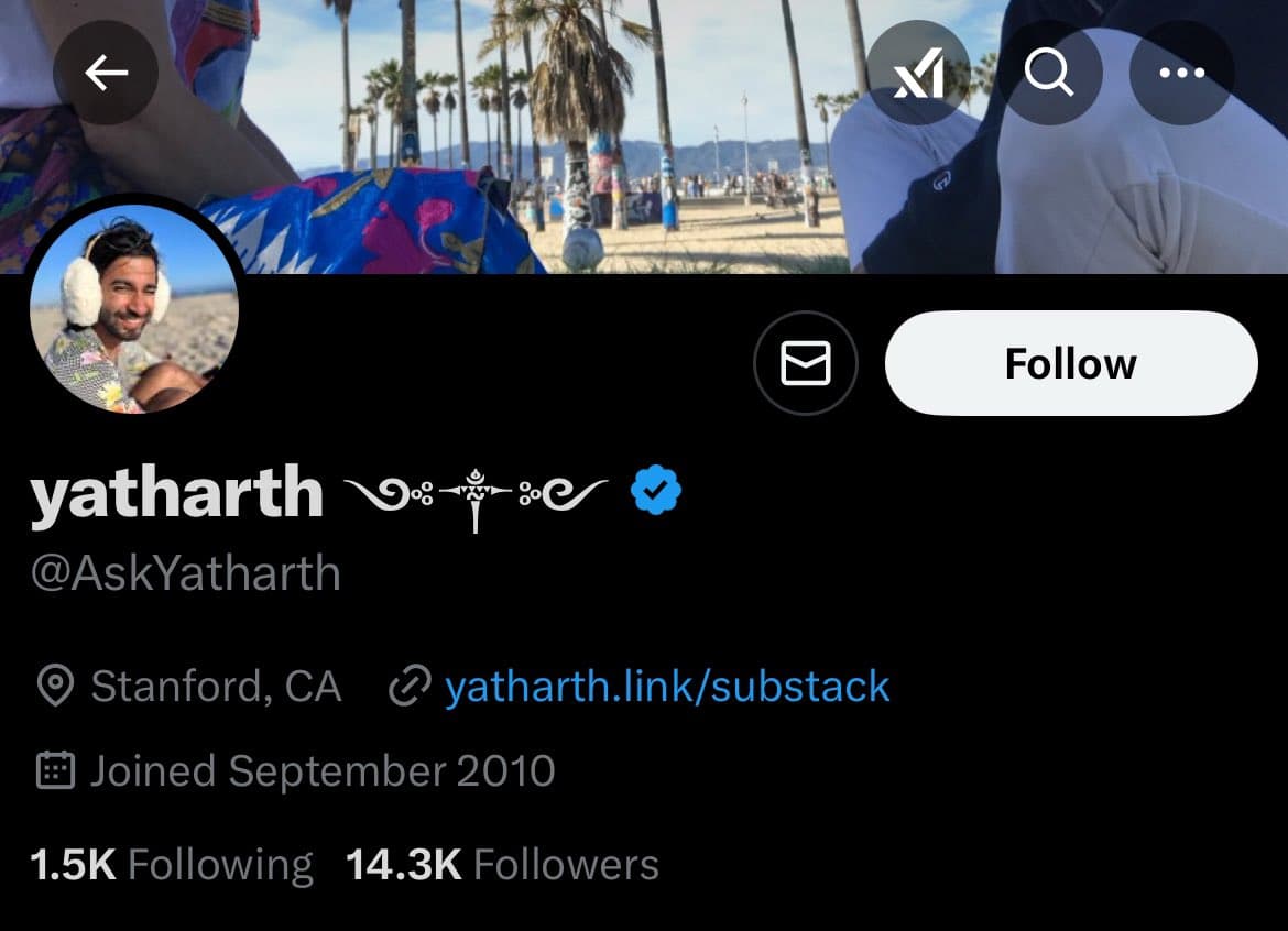 A screenshot of a Twitter profile page for the user 'yatharth' (@AskYatharth). The profile features a beach-themed header image, a circular profile picture of a man wearing earmuffs, and a blue verified checkmark next to the display name.