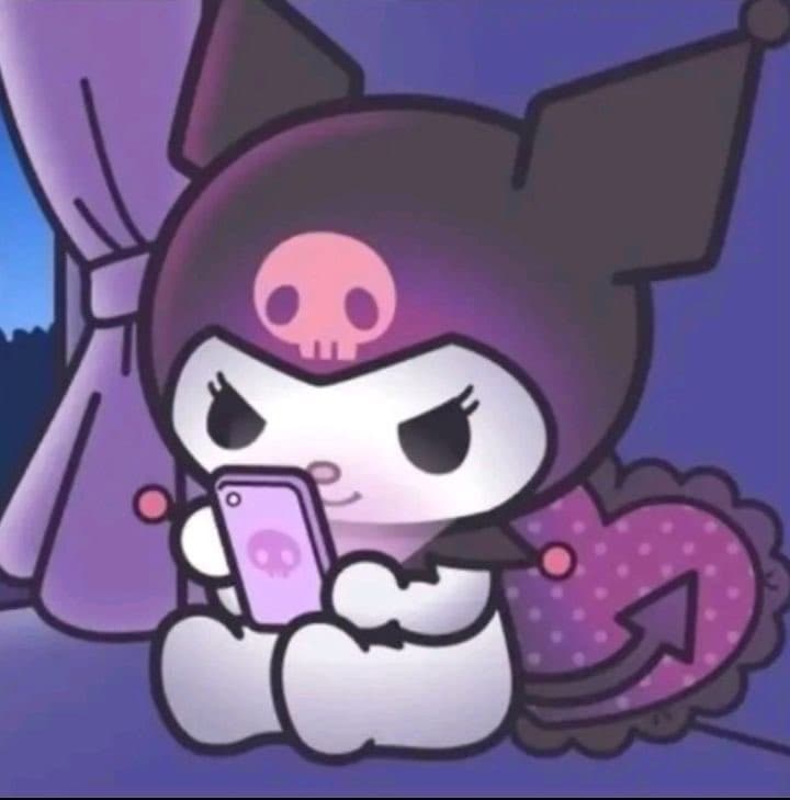 A digital illustration of the Sanrio character Kuromi sitting and looking at a pink smartphone. She is wearing her signature black hood with a pink skull, and a pink heart-shaped pillow is visible behind her.