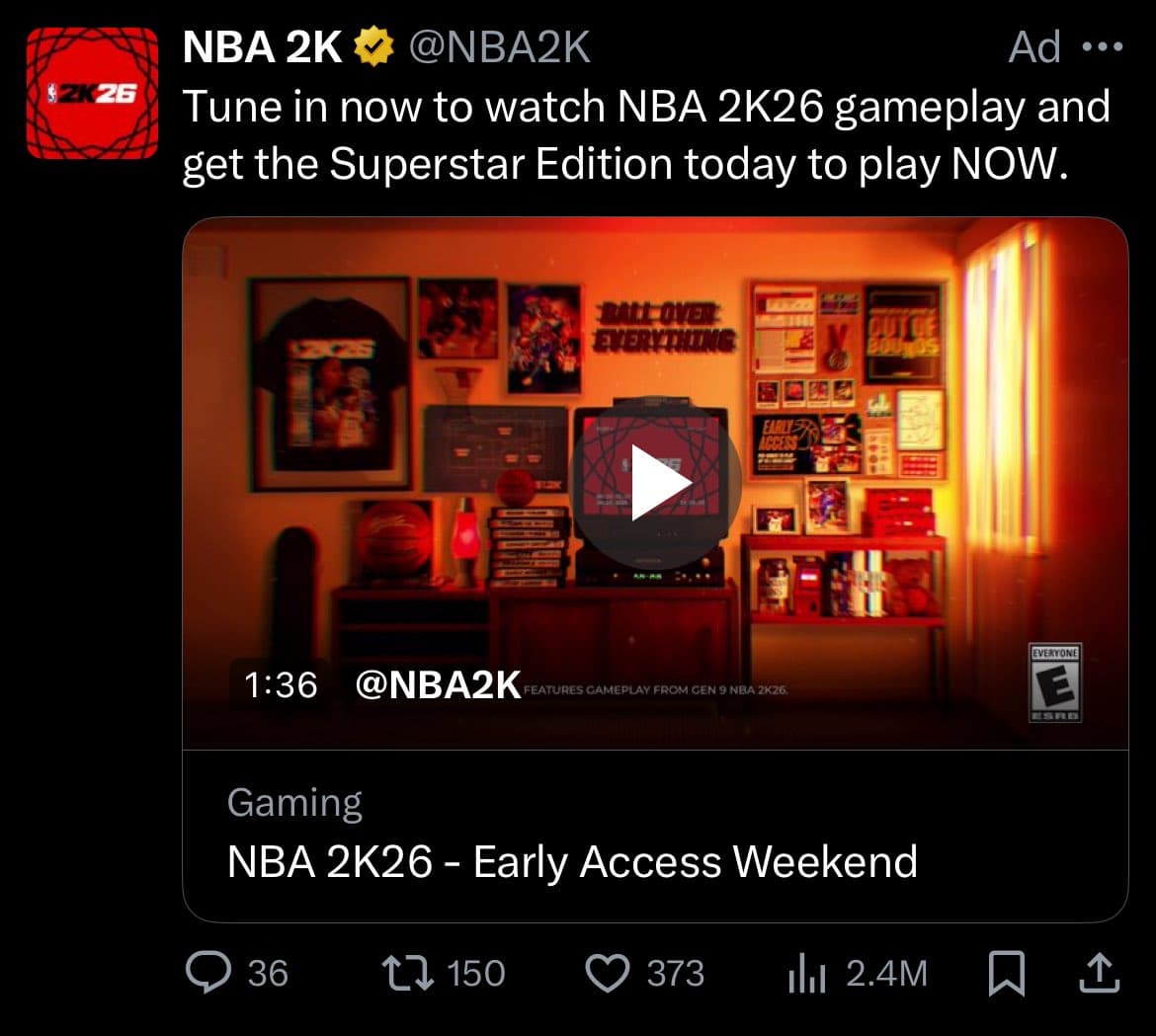 A screenshot of a Twitter ad from the official NBA 2K account promoting the game NBA 2K26. The ad features a video thumbnail of a video game room with a play button, along with text encouraging users to tune in for gameplay and get the Superstar Edition.