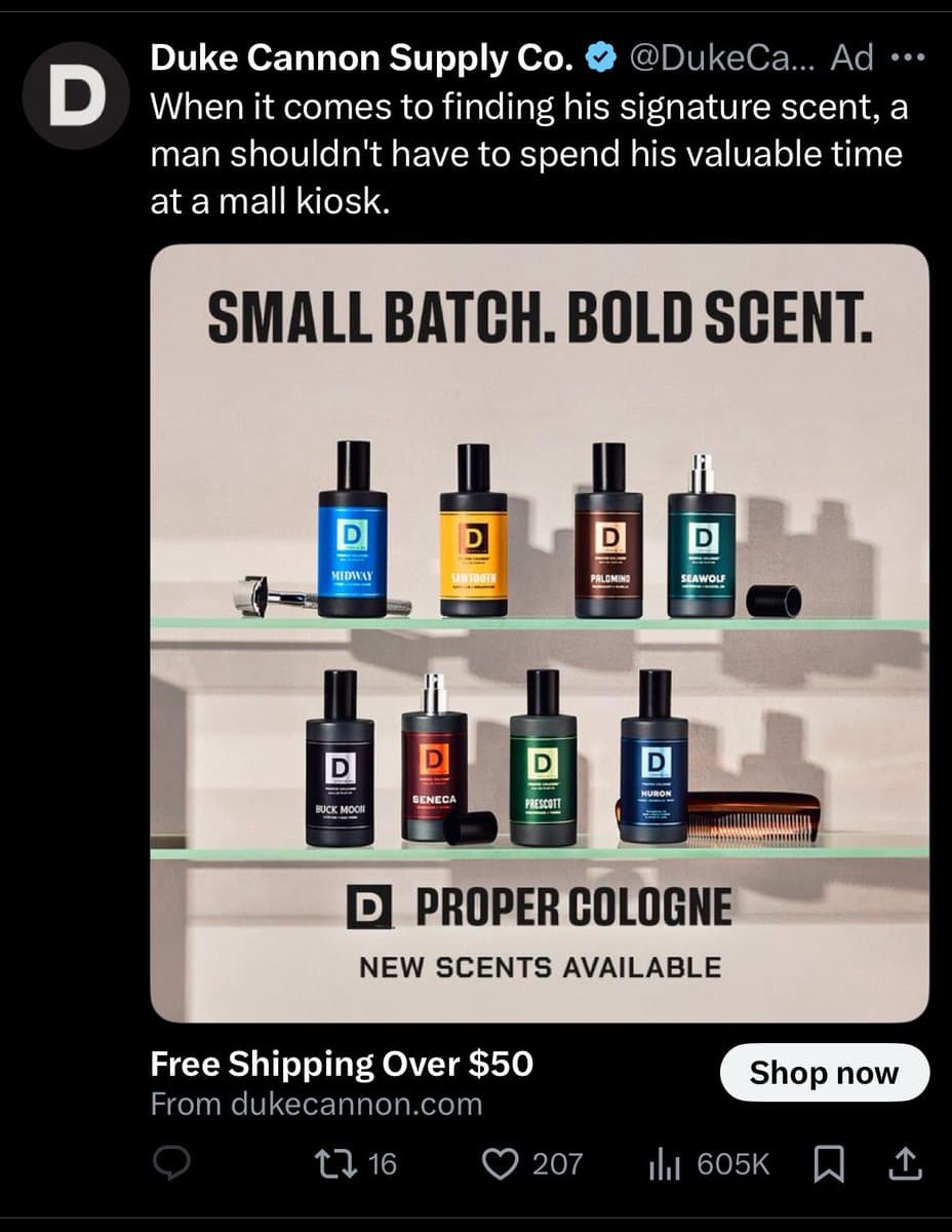 A screenshot of a Twitter advertisement from Duke Cannon Supply Co. featuring a product display of eight cologne bottles on glass shelves. The ad copy addresses men, stating, 'When it comes to finding his signature scent, a man shouldn't have to spend his valuable time at a mall kiosk.'