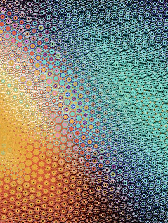A digital artwork featuring a repeating geometric pattern of hexagons and circles that transition through a vibrant color gradient from warm oranges and yellows to cool blues and purples. The image has a fractal or kaleidoscopic quality with intricate, layered details within each hexagonal cell.