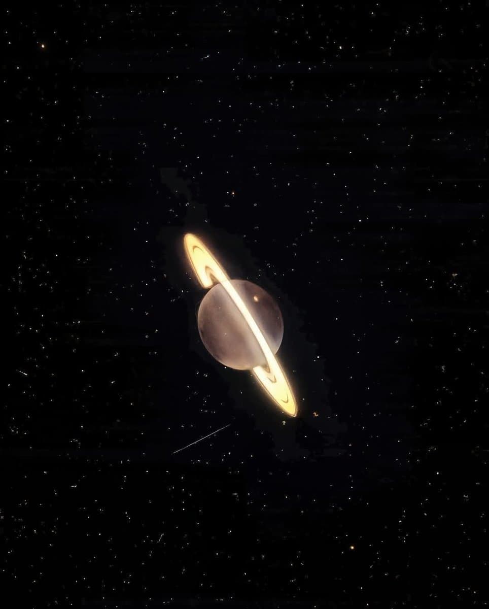 A photograph of the planet Saturn with its prominent rings, set against a dark, star-filled background. The image appears to be a deep-space observation, likely from a telescope, showing the planet's spherical body and its tilted ring system.