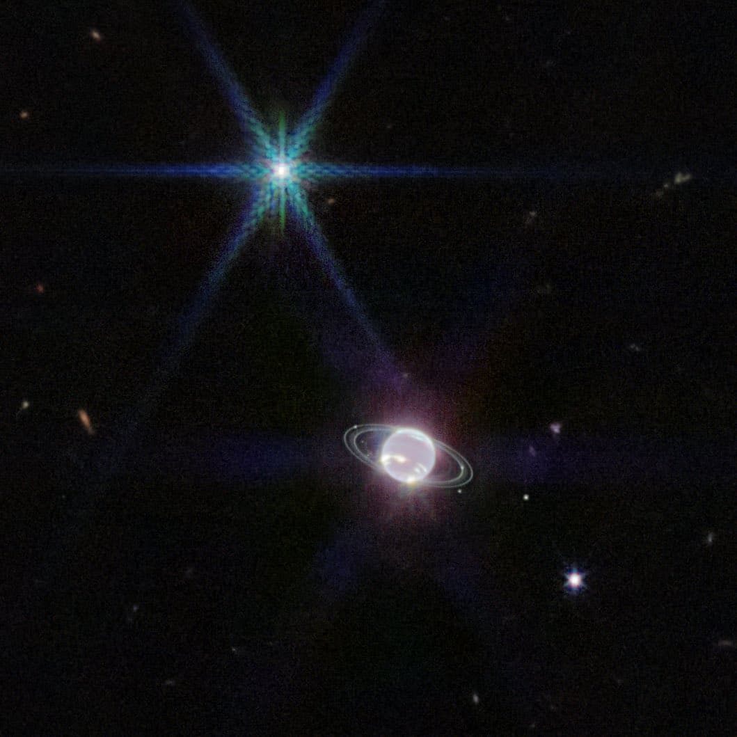 A digital illustration of a ringed gas giant planet orbiting a bright star with prominent diffraction spikes, set against a dark, star-filled space background.